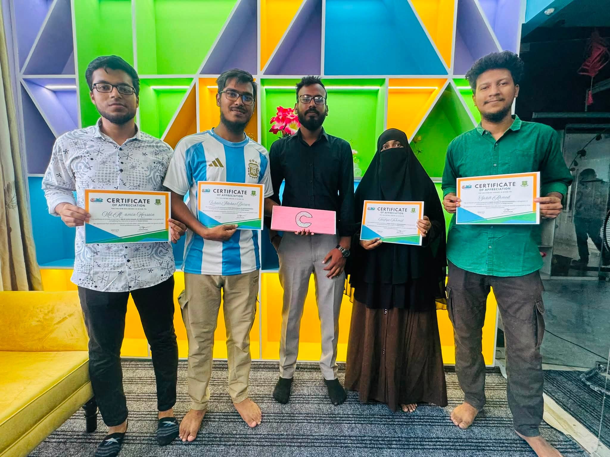 Colleagues with their certificates