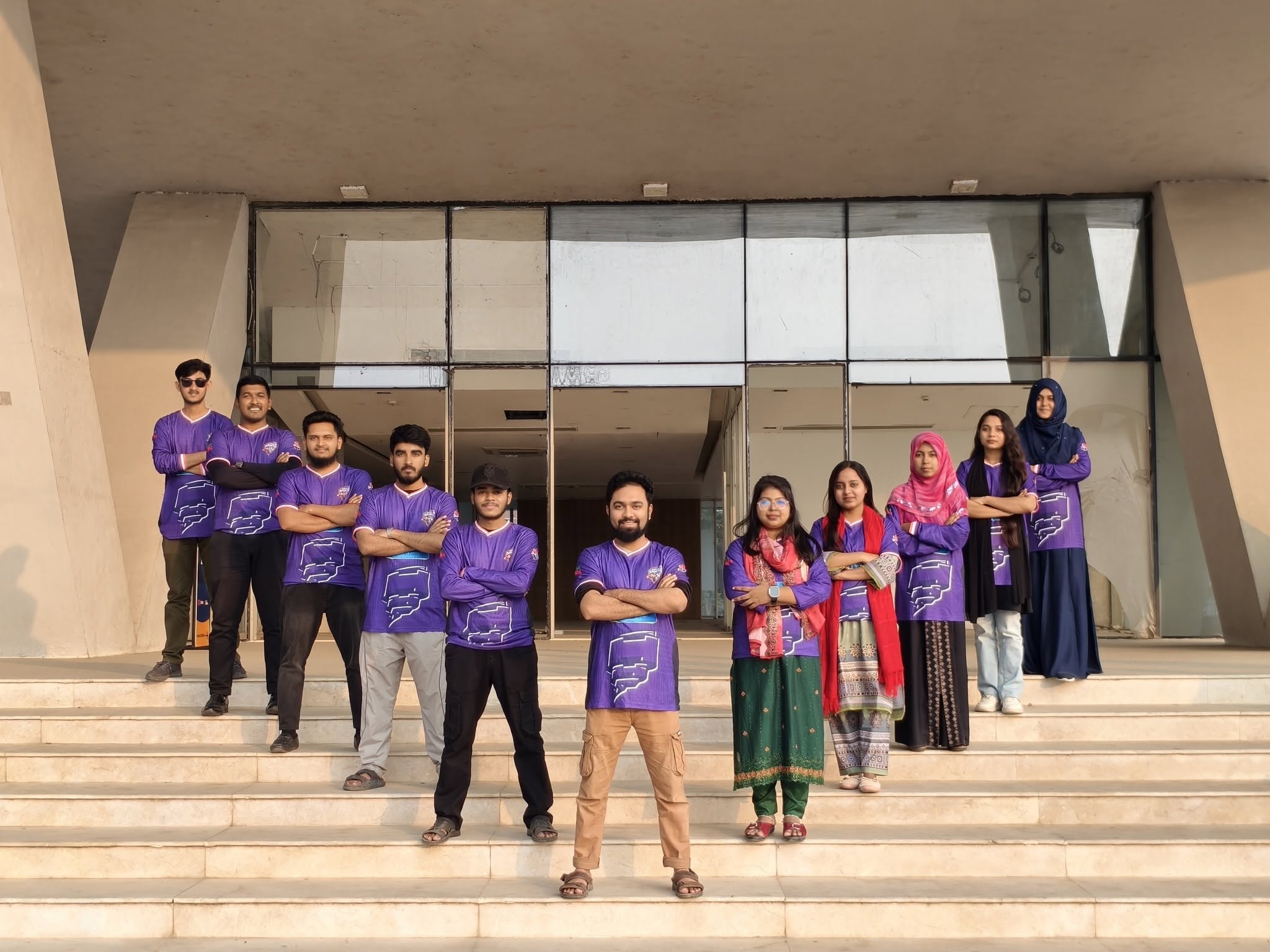 The team on the steps at the office entrance
